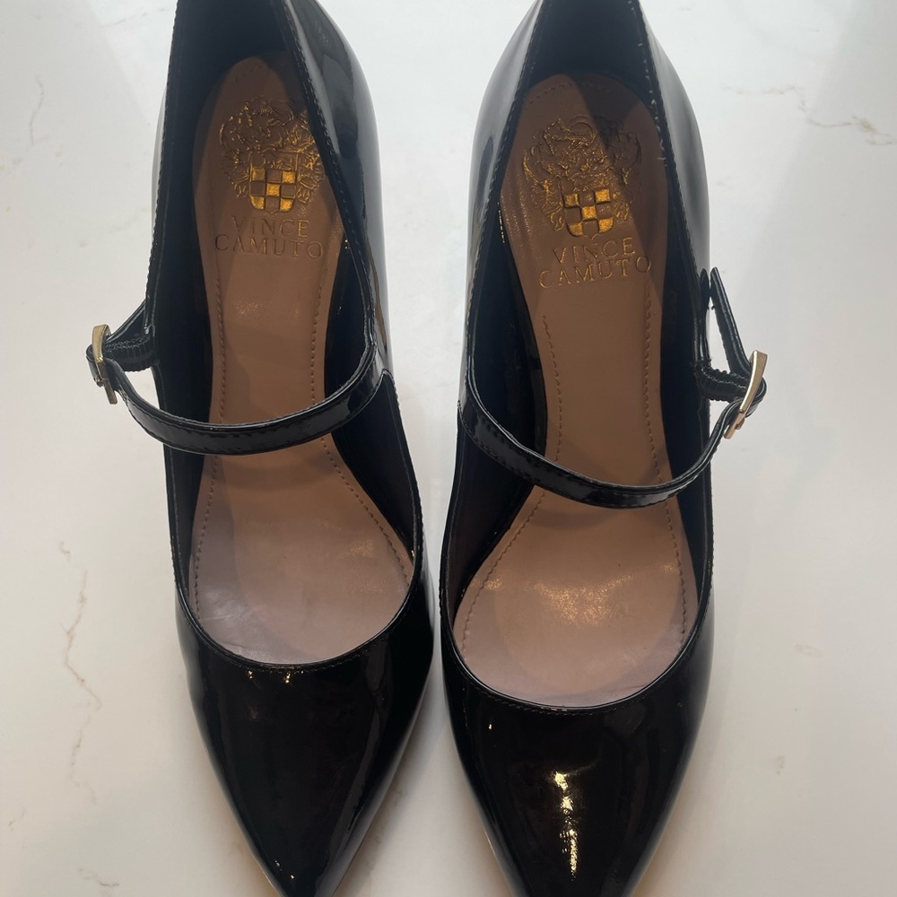 Black patent heels 8 1/2  Bite marks on left heel  look at pictures carefully.